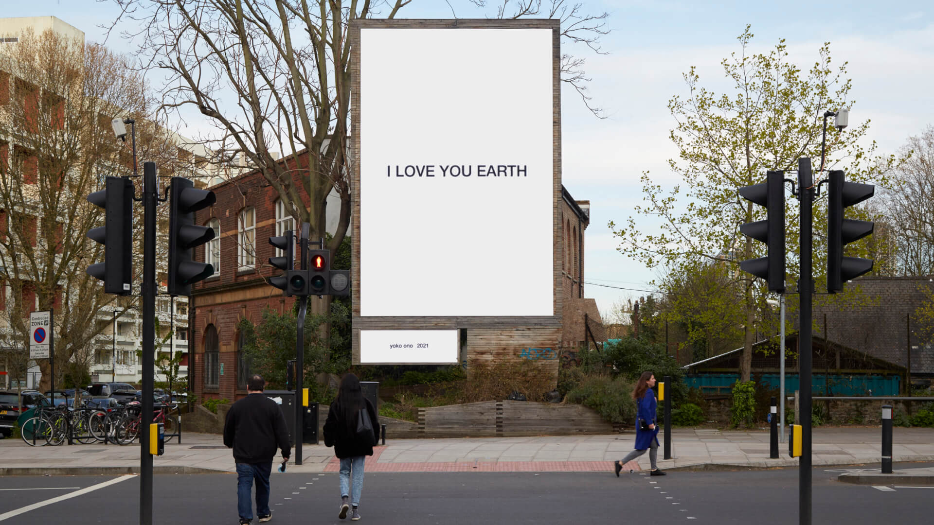 Image of an art installation by Yoko Ono, poster that reads: I Love You Earth