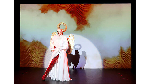 Photograph of Drag Queen Sasha Velour performing live, wearing angel wings