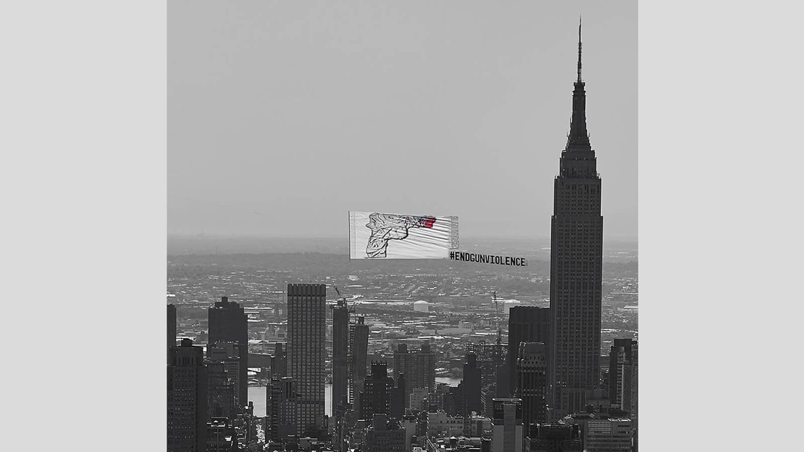 Image of gun violence protest banner over New York City