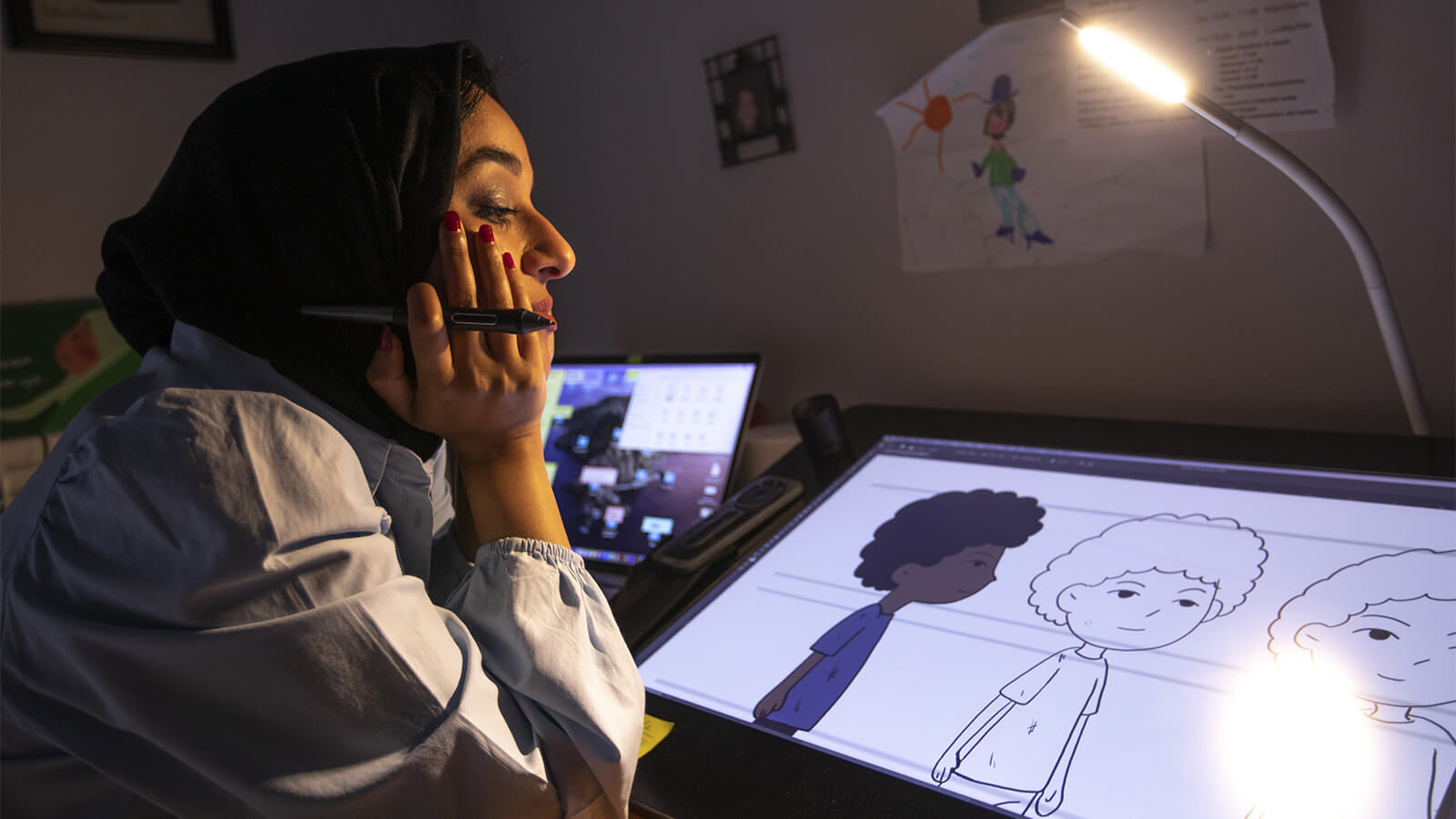 Portrait of graphic journalist Takoua Ben Mohamed in her studio