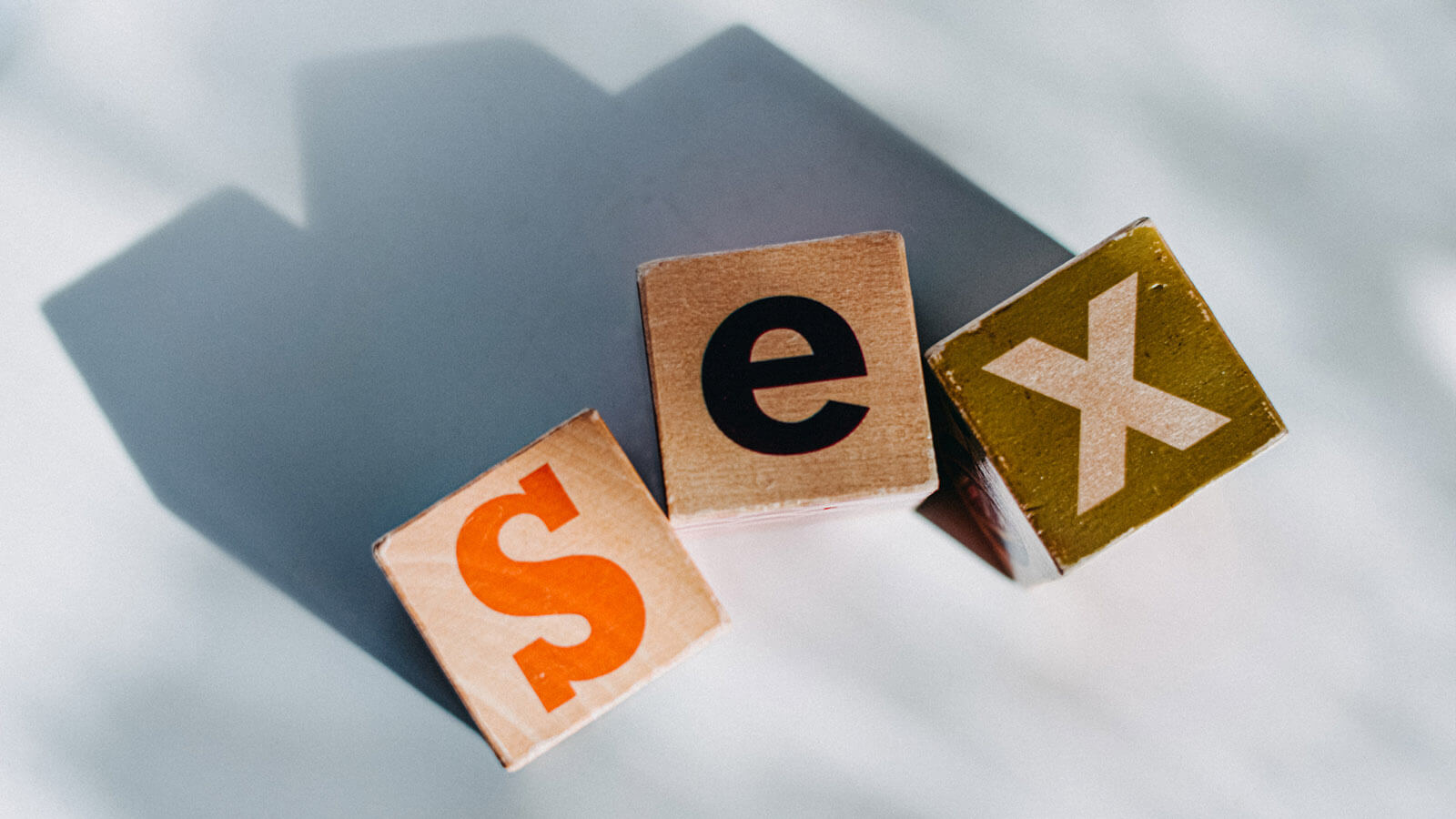 The word 'sex' spelt out in wooden blocks