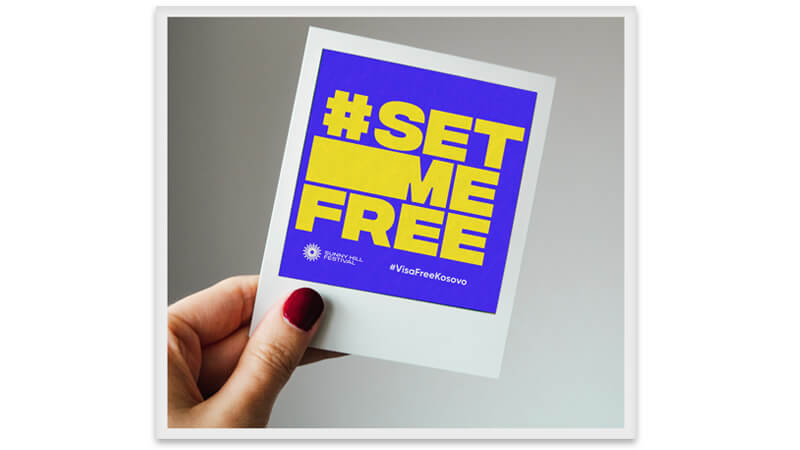 Image of hand holding polaroid picture, featuring the Set me Free Campaign