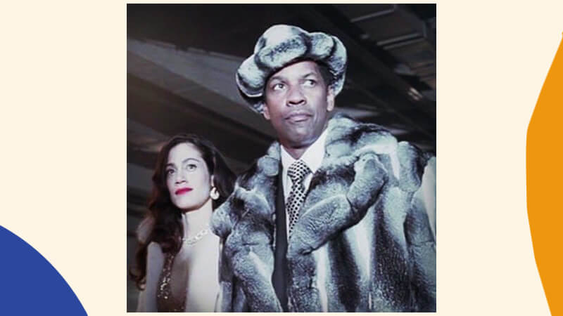 Film Still from American Gangster featuring Denzel Washington wearing fur coat and hat
