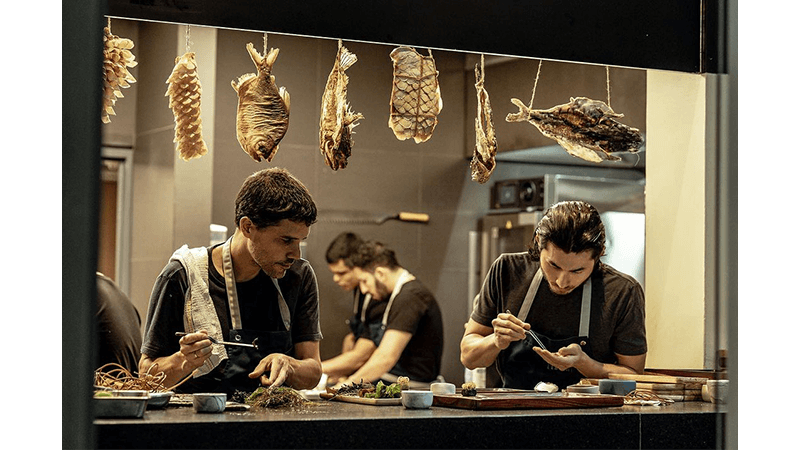 Chefs preparing food at Central, Lima